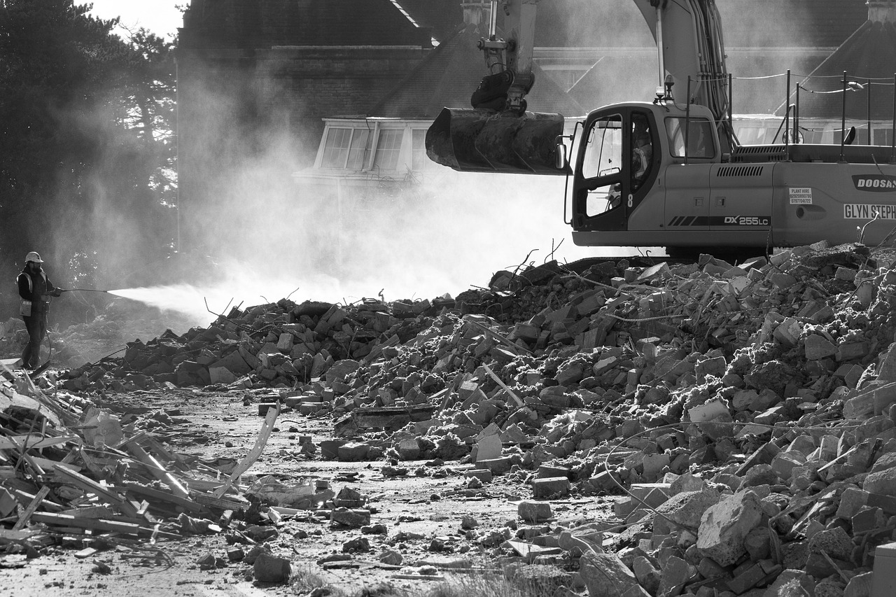 Groundworks contractor reviewing an incomplete cost estimate at a construction site