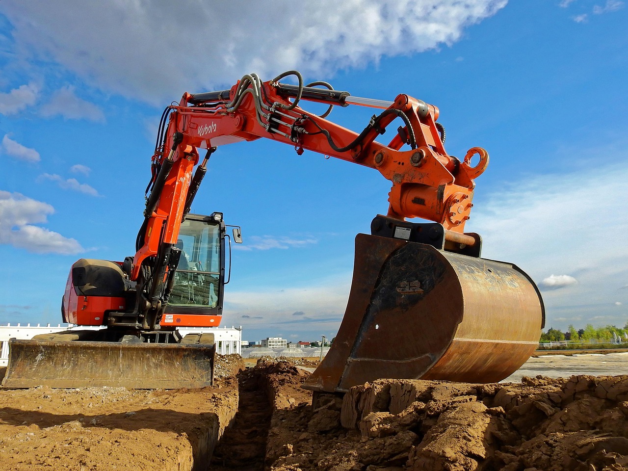 Excavation work revealing unexpected drainage and foundation costs during construction