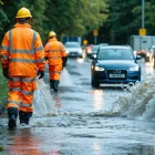 Civil engineers survey stormwater runoff across rain-soaked urban streets