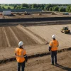 Engineering team assessing ground conditions at a British brownfield development site